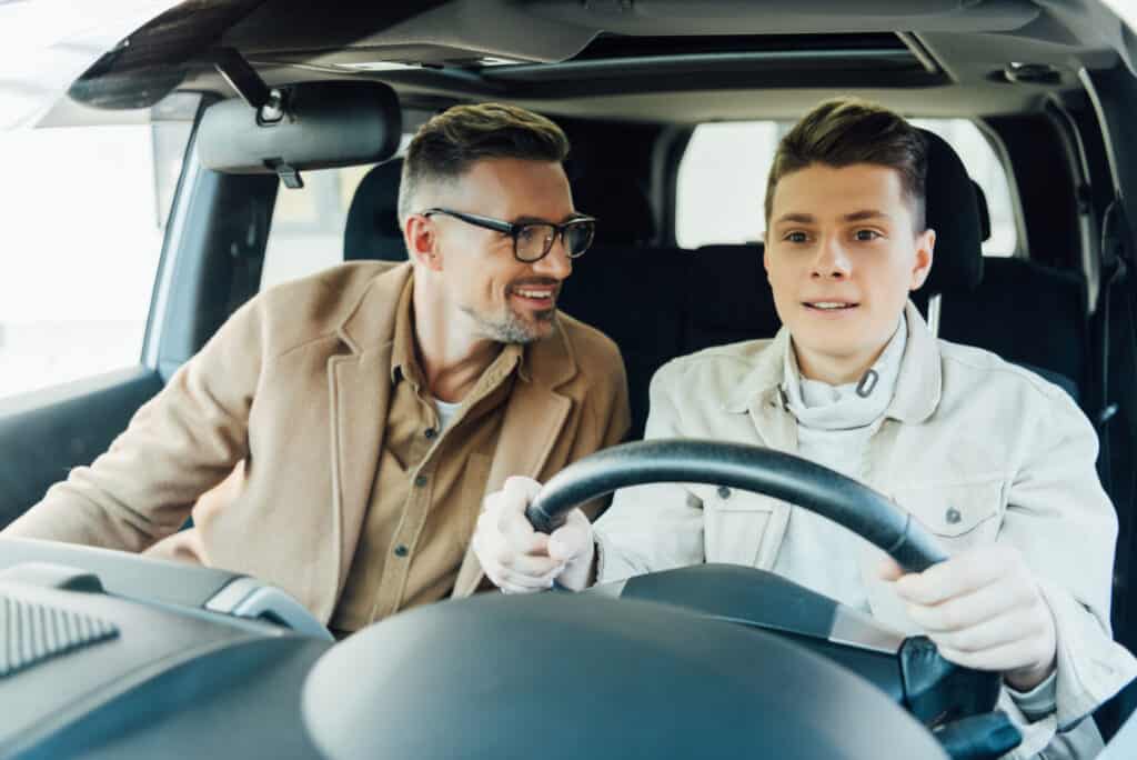 father-teaching-son-to-drive