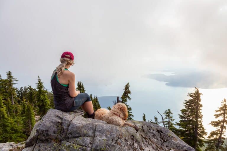 girl-sitting-on-mountatin-top-with-her-god