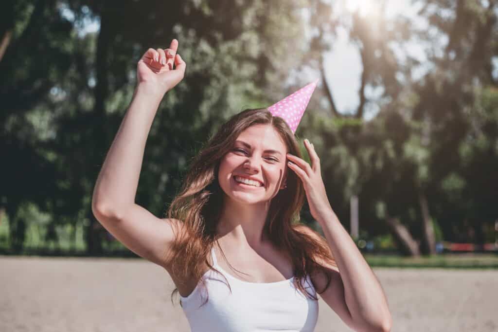 happy-woman-with-festive-hat-and-attitude