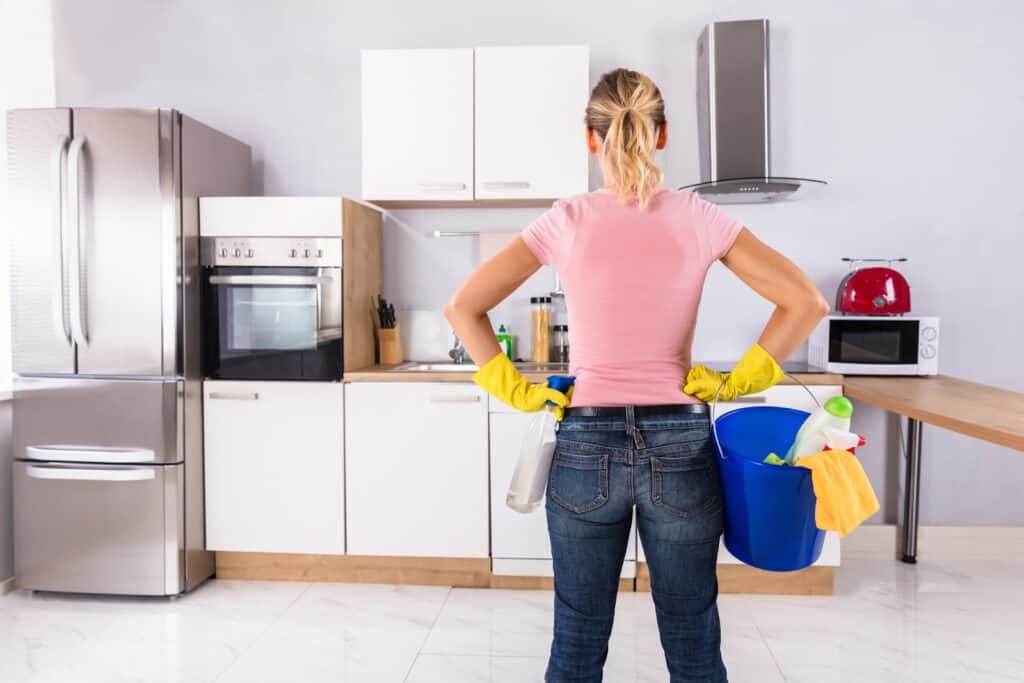 woman-holding-cleaning-equipment