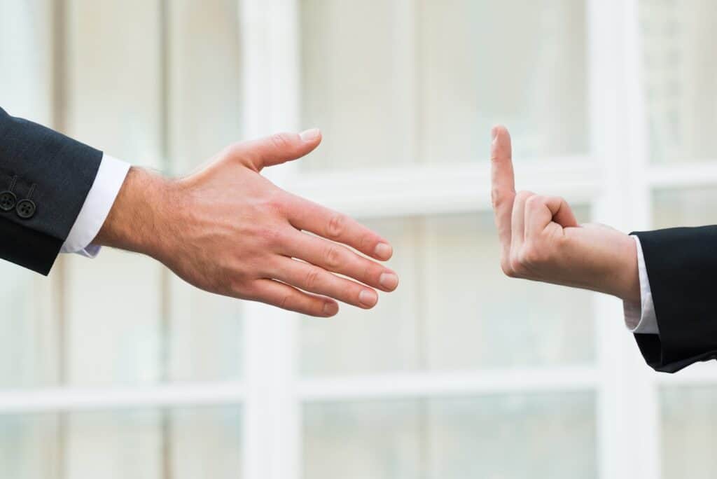 middle-finger-and-hand-shake