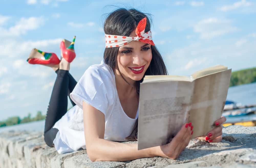 woman-reading-book-on-beach