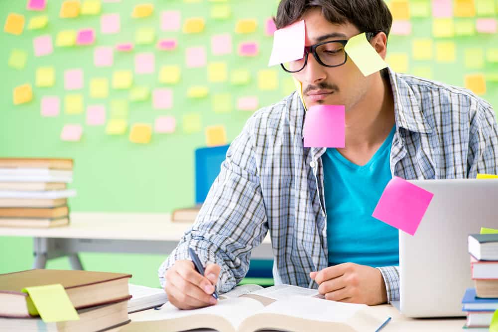 student-with-sticky-notes-all-over-face