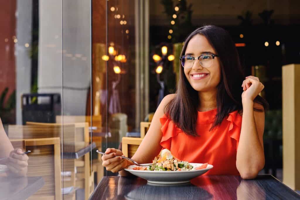 girl-enjoying-lunch-at-restaurant