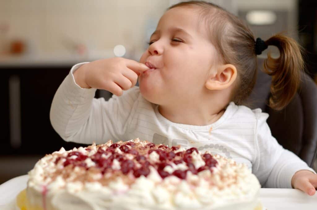 cute-little-girl-enjoying-cake