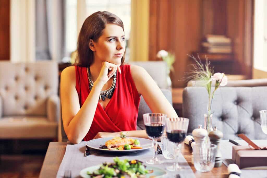 woman-in-deep-thought-alone-at-restaurant