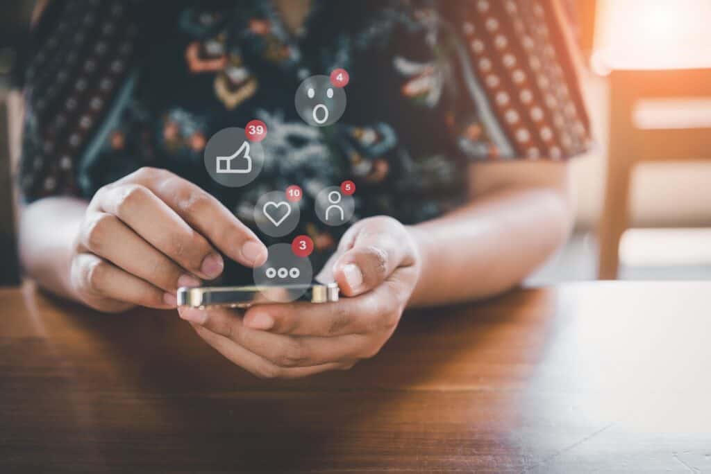 social-media-and-technology-internet-communication-connection-concept-business-woman-s-hands-is-using-social-media-via-smartphone-with-notification-icon-technology-digital-media-mobile-phone-network