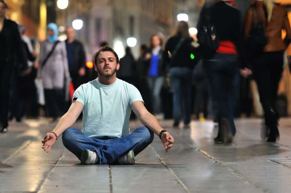 young-man-meditating-yoga-in-lotus-position