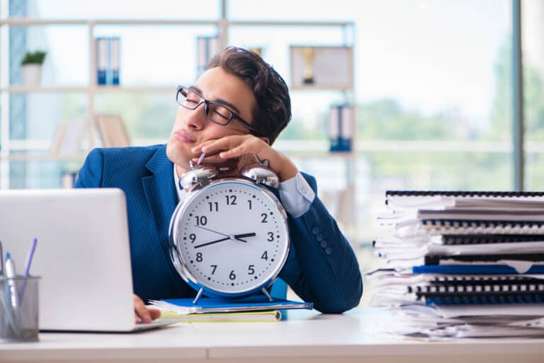 tired-worker-sleeping-at-desk