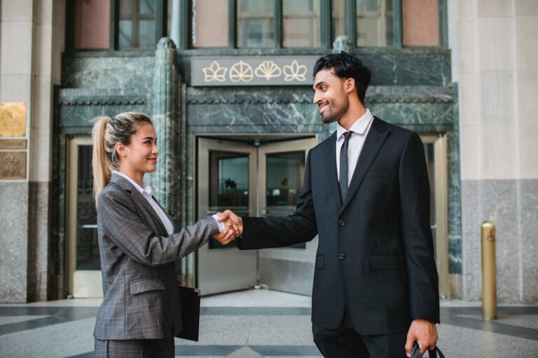 friends in business shaking hands