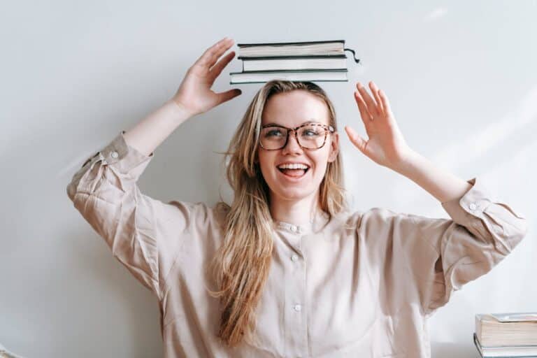 girl balancing books on head